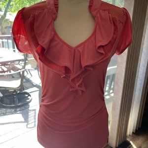 Women’s size medium top. Color is coral in great condition